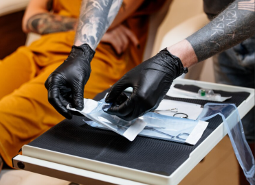 Sterile Equipment,” “Single-Use Needles,” “Licensed Artists,” “Health Dept. Certified.”