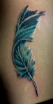 feather in color tattoo pistol petes tattoo saloon tattoo by pete salais best tattoo artist texas Tattoo shop tattoo studio 